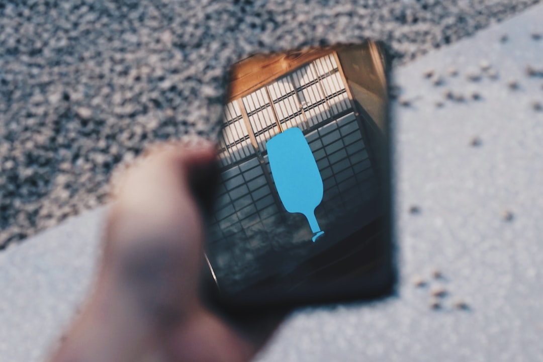 person-holding-smartphone-dxe7nfexynw